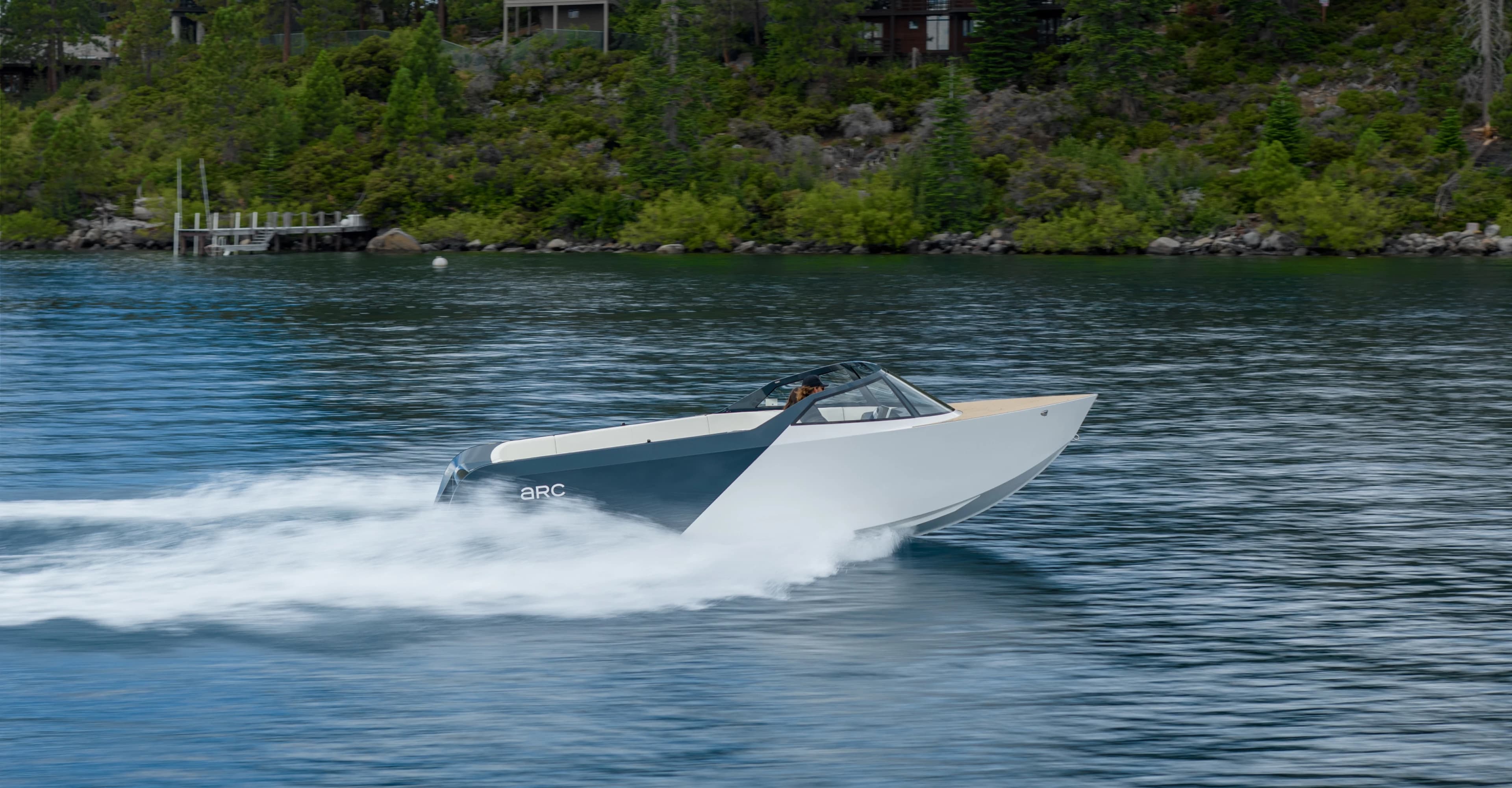 A photograph of an EV boat zipping through the water