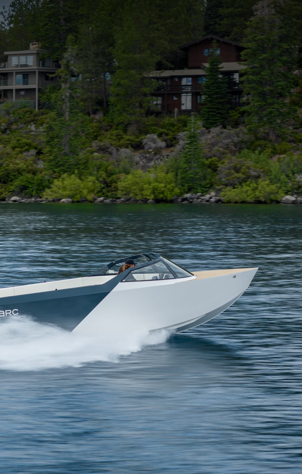 A photograph of an EV boat zipping through the water
