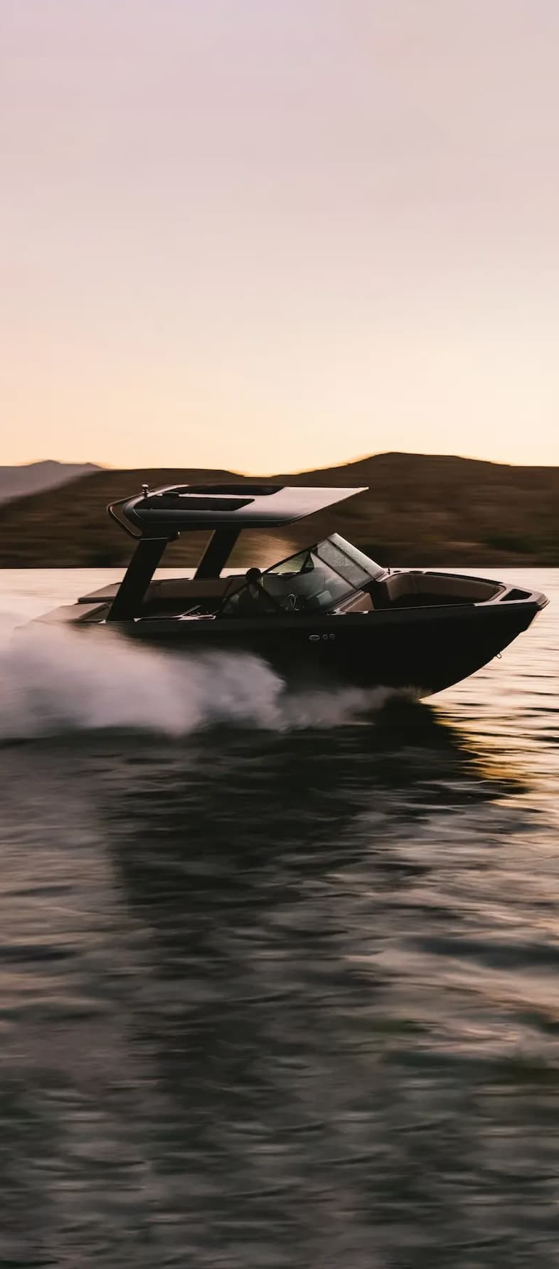 A photograph of an EV boat zipping through the water